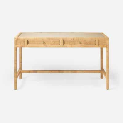 Small, light brown peeled rattan desk with two drawers and glass top.