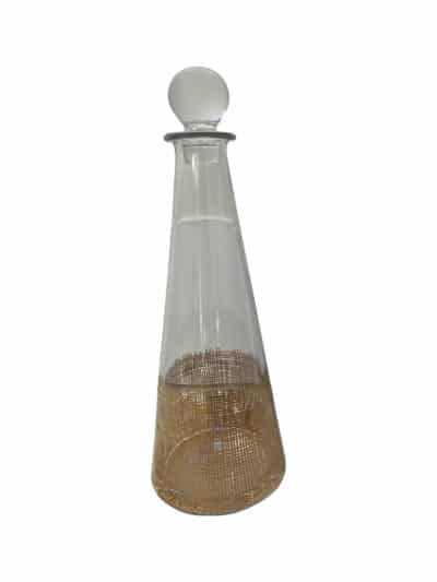 Vintage glass decanter with gilded grid base, showcasing its elegant design and craftsmanship.