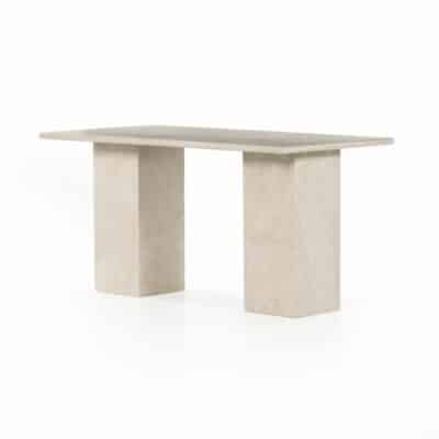 Sculptural cream marble console table with block legs, showcasing natural veining variations in its design.