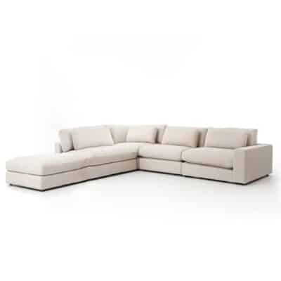 Blaine 4 Piece Sectional Sofa in a neutral color showcasing its floating ottoman portion and easy movement design set against a white