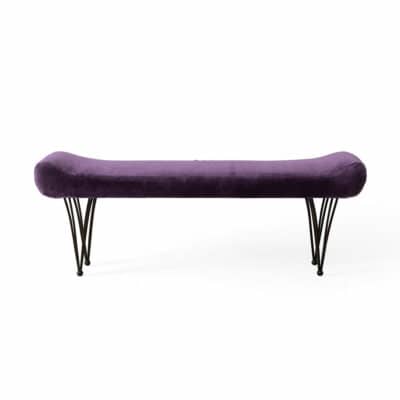 Deep purple velvet bench with brass-finished base.
