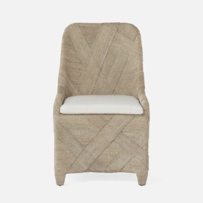 Wicker dining chair with crisscrossed design, featuring a white cushion on top.