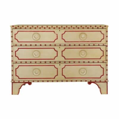 The Big Pine Key Chest is shown in an image showcasing its elegant design featuring a butter pecan finish with cherry trim