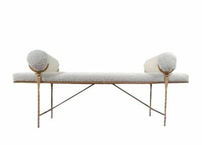 Boucle Scepter Bench with plush neckroll bolster pillows, upholstered in luxurious fabric.