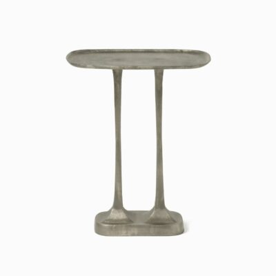 Close-up of Brenna Accent Side Table in Antiqued Silver, featuring an uneven edge on the tray top and nature-inspired legs.
