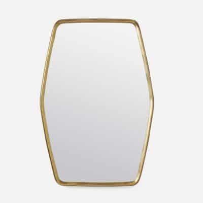Gold-trimmed oval mirror in shiny brass finish.