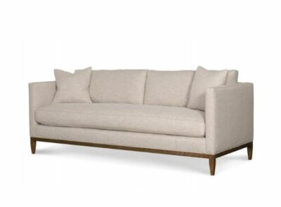 Sand-colored upholstered sofa with brownstone frame, featuring down seat fill and feather back cushions.