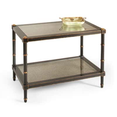 Two-tiered black side table with elegant cane, glass, and gold accents for stylish storage.