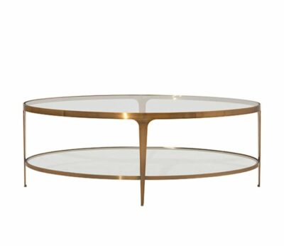 Oval metal coffee table with glass top, available in antiqued brass or gunmetal finish.