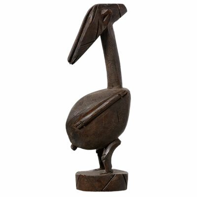 Close-up of intricately carved wooden African figure, showcasing craftsmanship and unique design.