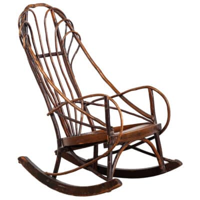 The alt text should be: "Antique child's rocking chair crafted from hickory and oak, circa 1915.