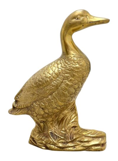 Large golden duck statue, vintage brass craftsmanship on display.