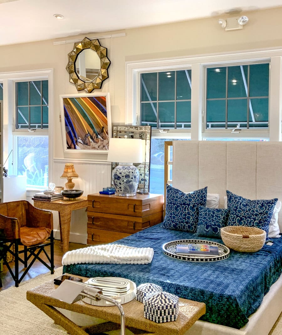 Surfboards Reproduction Photograph in Contemporary White Frame, displayed on wall with blue bedding in bedroom setting.
