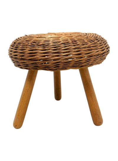 Vintage wicker stool with three legs, featuring a brown woven seat atop a sturdy wooden base in mid-century modern style.
