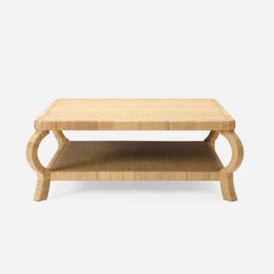 The image shows a natural peeled rattan coffee table with an exaggerated frame available in two sizes The table has a rectangular