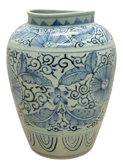 Blue and white open jar with floral design, close-up side profile in Palm Beach.