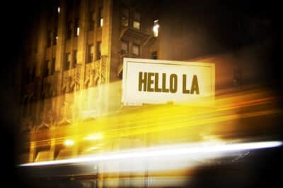 Close-up of Hello LA Photograph, framed in black, featuring vibrant city lights at night.