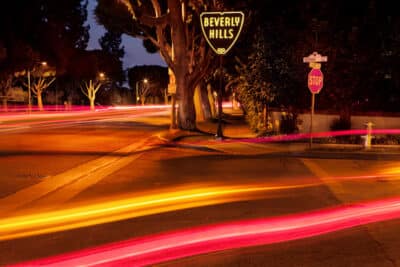 Sunset and Sierra, Beverly Hills framed print by Connie Conway showcasing vibrant colors and city lights at dusk.