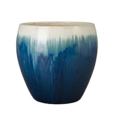 Blue and white ceramic planter in an ombre pattern, showcasing its vibrant colors and smooth finish.