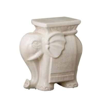 Alt Text: "White ceramic elephant stool with crackle finish.