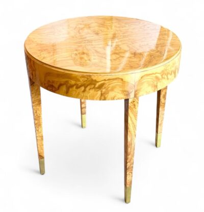 Round wooden table with olive ash burl top, polished brass feet, and available in walnut burl.