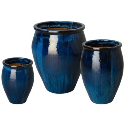 Blue ceramic planter set in various sizes, perfect for adding a touch of color to your outdoor space.