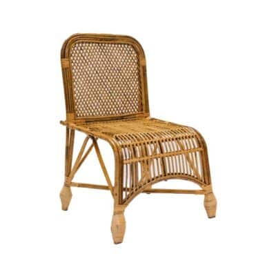 Close-up of handwoven rattan chair with intricate design, showcasing unique artisan craftsmanship.