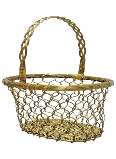 Close-up of vintage brass basket with tightly braided handle.