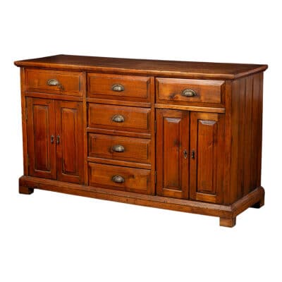 A vintage oak buffet with aged patina featuring three top drawers three center drawers and two-door interior shelves on either side of