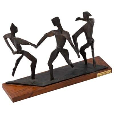 Vintage bronze dancers sculpture on walnut base, artist signed.