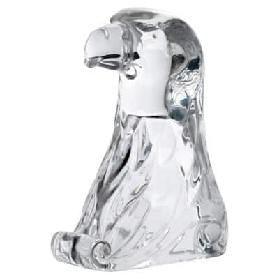 Close-up of vintage glass bald eagle figurine, intricate details and polished finish.