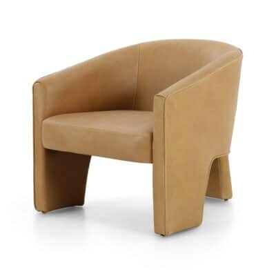 Stylish three-legged armchair crafted from Italian leather, available in nude, sienna or butterscotch hues.