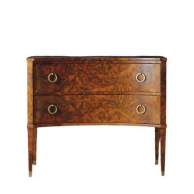 Close-up of two drawer concave burl commode in dark wood finish with antiqued brass hardware.