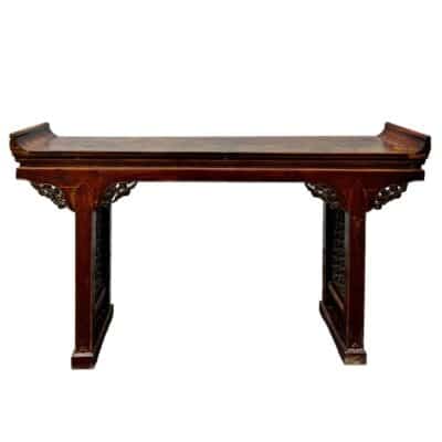 Antique Chinese console table, double-sided, aged wood plank top, ornate carved fretwork on legs and apron.
