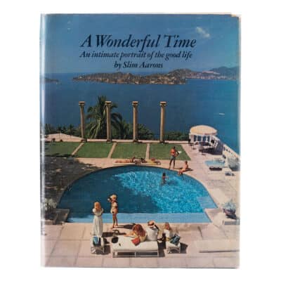 Illustrated cover of Slim Aarons' first edition book, depicting a relaxed poolside scene in vibrant colors.