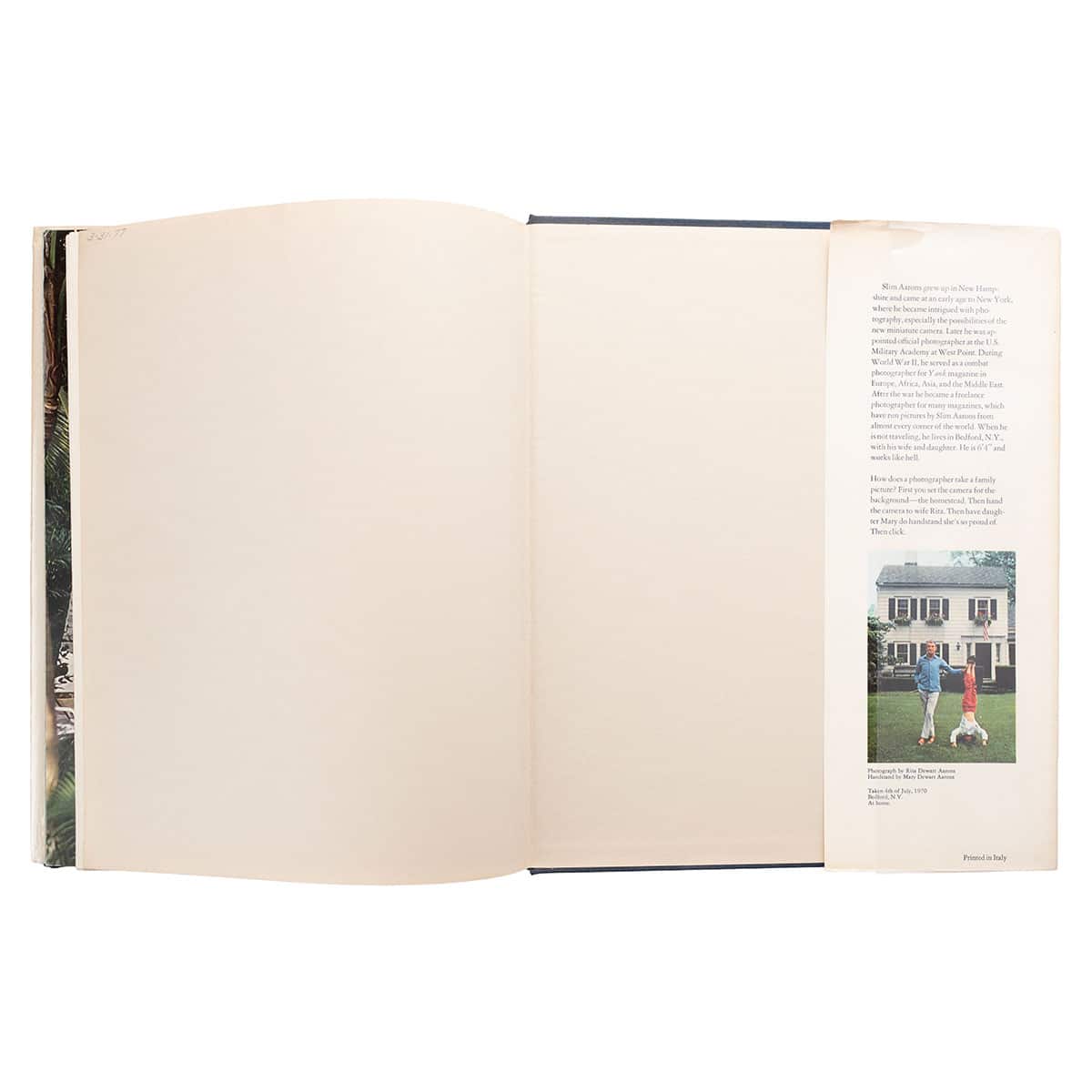 A first edition book in good condition, signed by Slim Aarons.