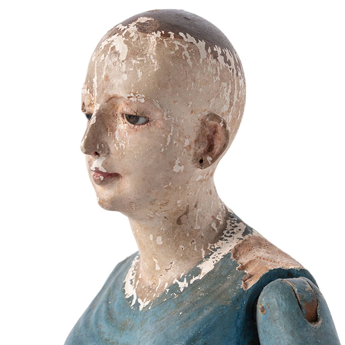 Close-up of antique painted wood cage doll with original paint, antique wear and patina.