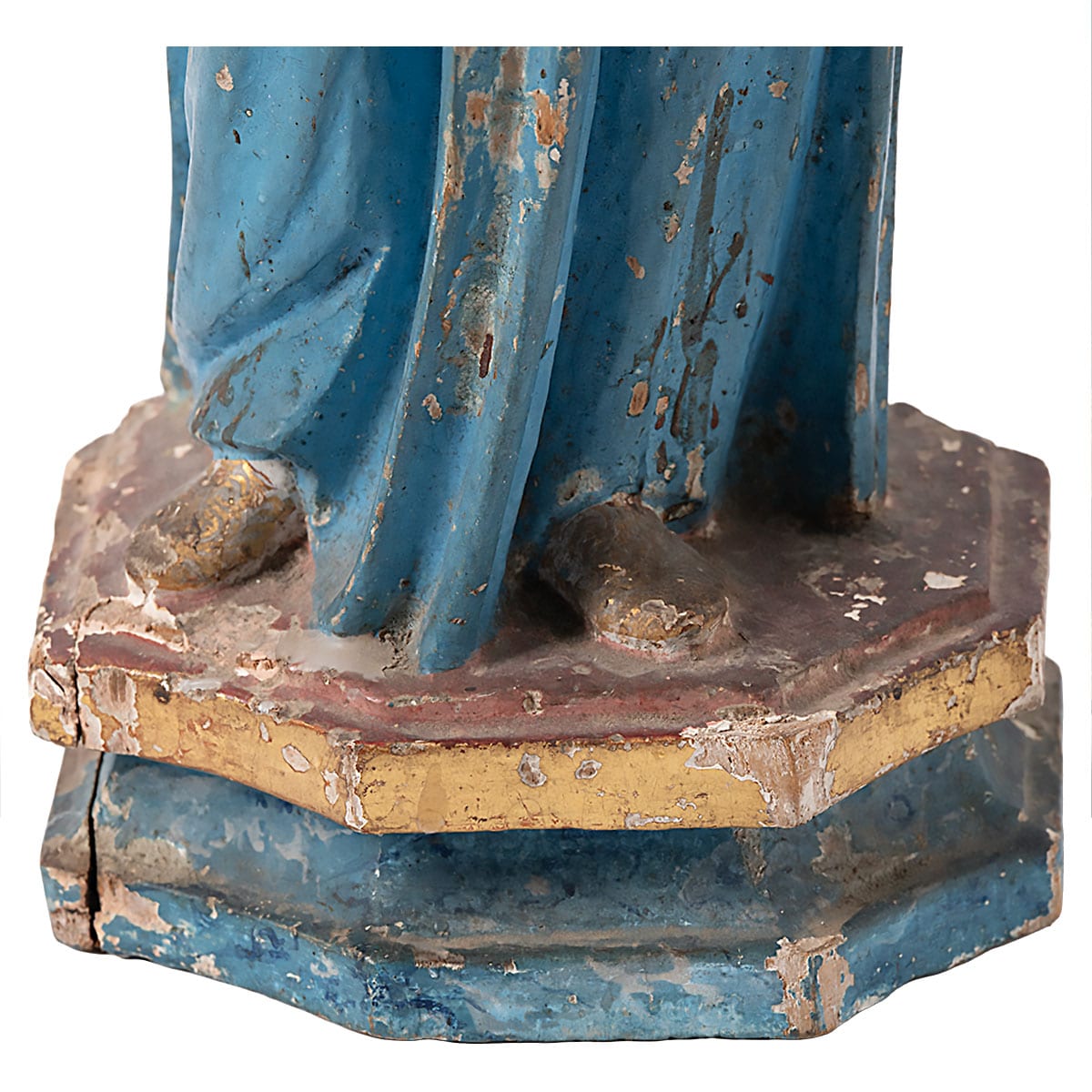 Antique polychrome wood Santos doll, showcasing intricate carvings and vibrant colors, exuding an air of antiquity.