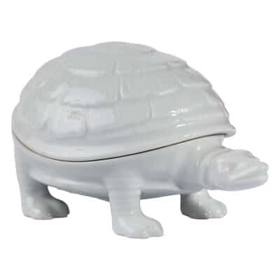 Close-up of vintage French tortoise box in white porcelain, featuring intricate shell pattern and removable top.