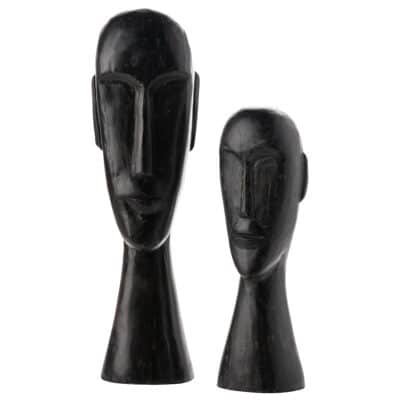 Hand-carved wooden sculptures depicting African heads, each unique in design and approximately 15"-20" tall.