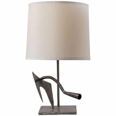 Vintage French lamp crafted from tools, close-up of unique metal base design.