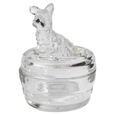 The vintage glass box is shaped like a Scottie dog featuring a small round design with a removable top The intricate detailing