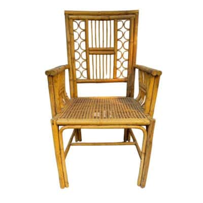 Front view of vintage bamboo Brighton arm chair with woven seat.