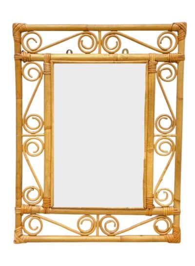 Close-up of Vintage Mid-Century Rattan Mirror featuring intricate swirl design and bamboo frame.