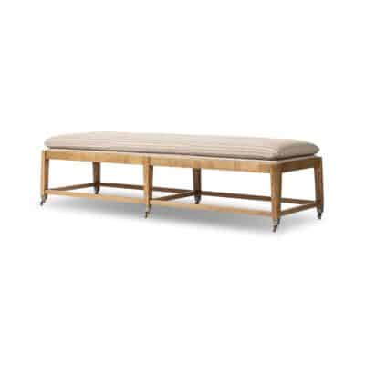 Striped bench with six legs, featuring an ash base and aged brass casters.