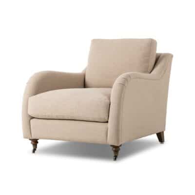 Taupe armchair in front view, featuring rolled arms and turned legs, showcasing cozy comfort.