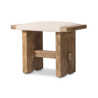 Distressed oak rectangular stool with cream upholstered seat and bottom stretcher.