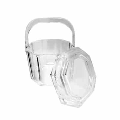 Close-up of vintage Lucite ice bucket with intricate design.