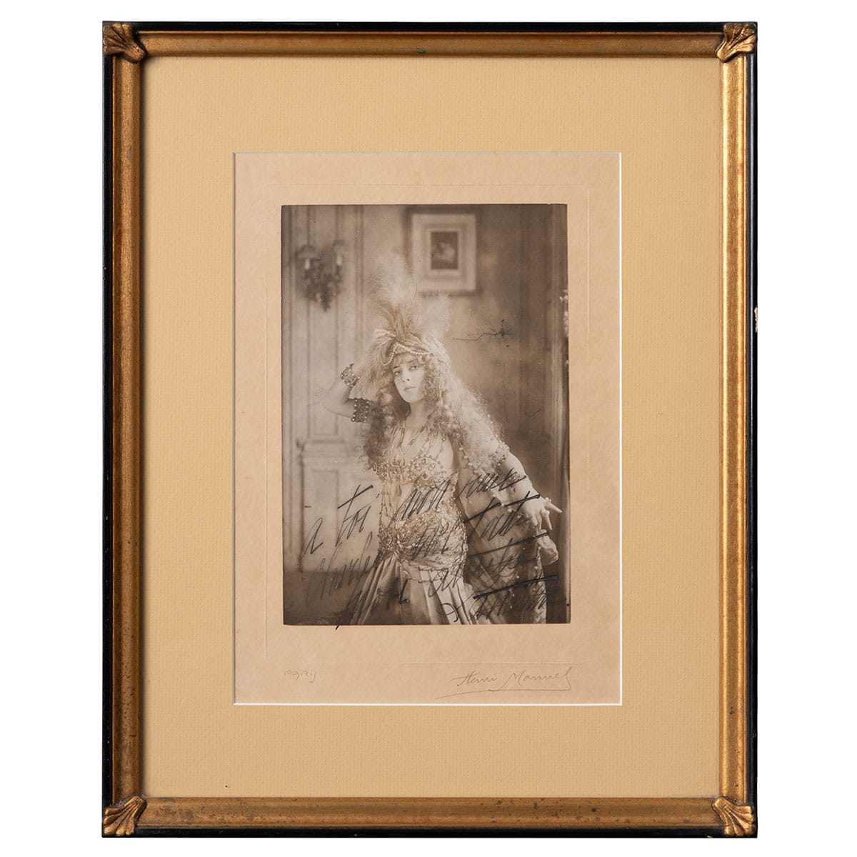 Close-up photograph of French actress Sara Bernhardt, signed by Henri Manuel.