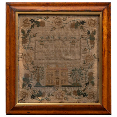 Framed Antique English Needlework Embroidery Sampler Showcasing Central Brick House Trees Birds and Floral Border in Early Mid 1800s Style with Aged